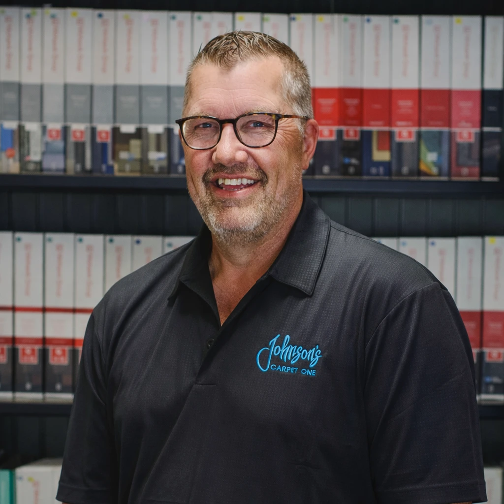 Darwin Sterken, Smiling professional at flooring showcase